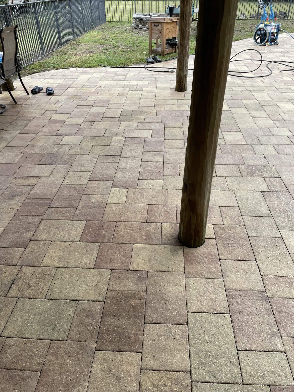 The same paver patio washed back to its original warm tones in Lake Worth FL